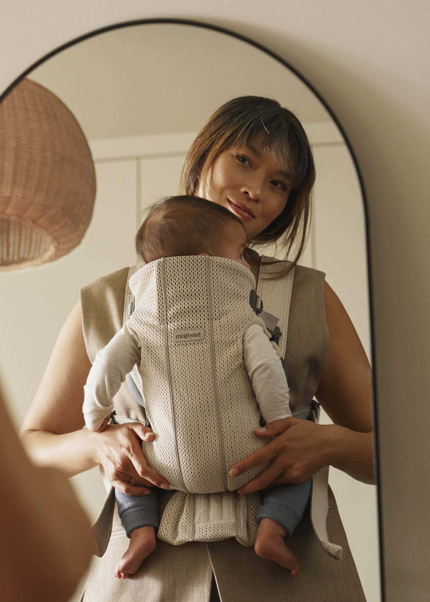 BabyBjorn Baby Carrier Mini in cream mesh with baby