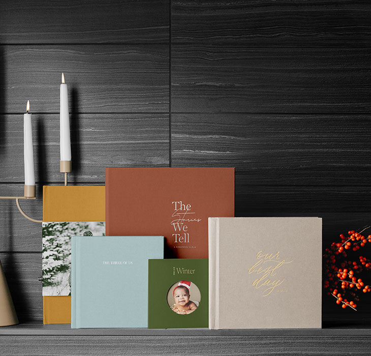 Artifact Uprising softcover photo books arranged on a shelf