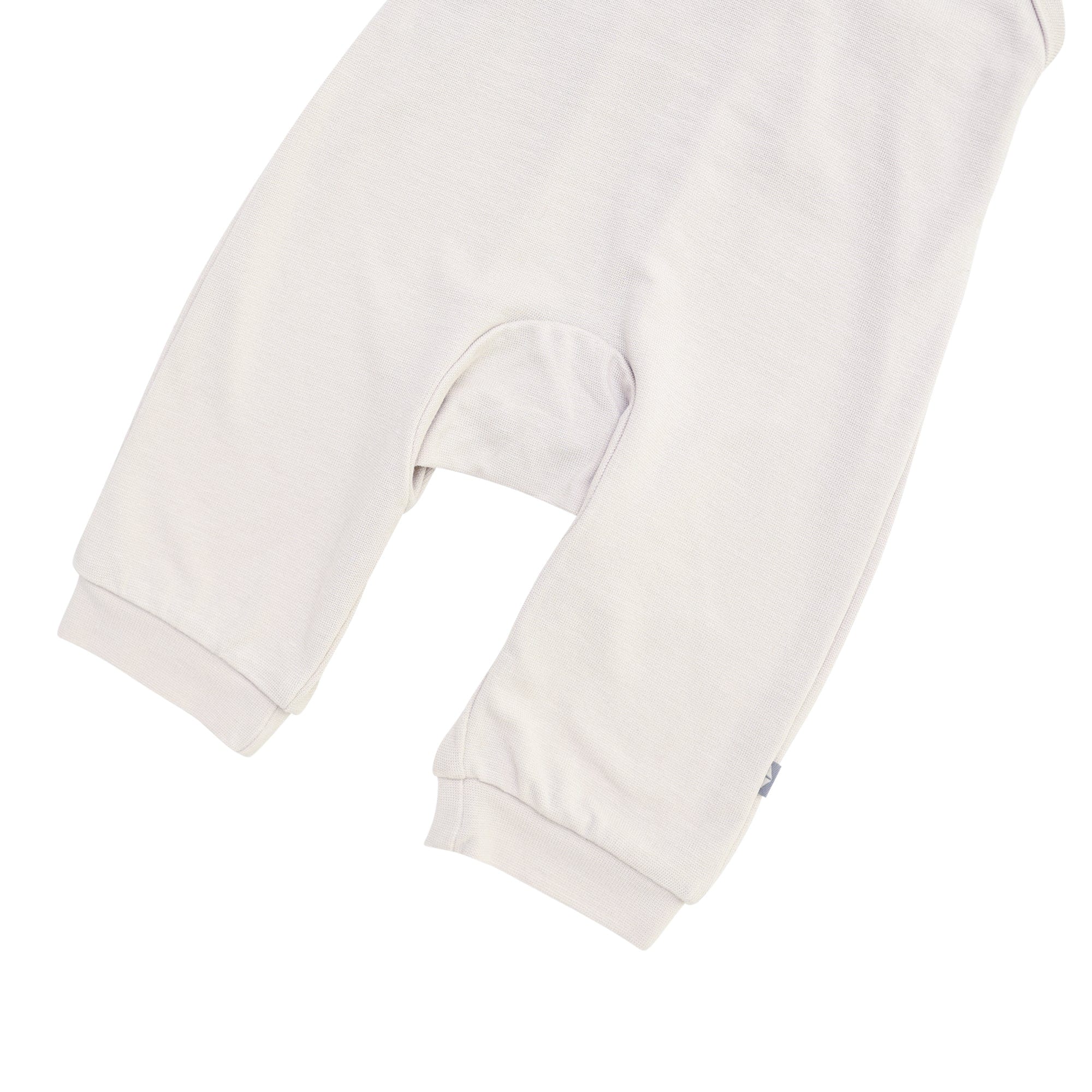 Kyte Baby bamboo jersey overall in oat warm neutral color