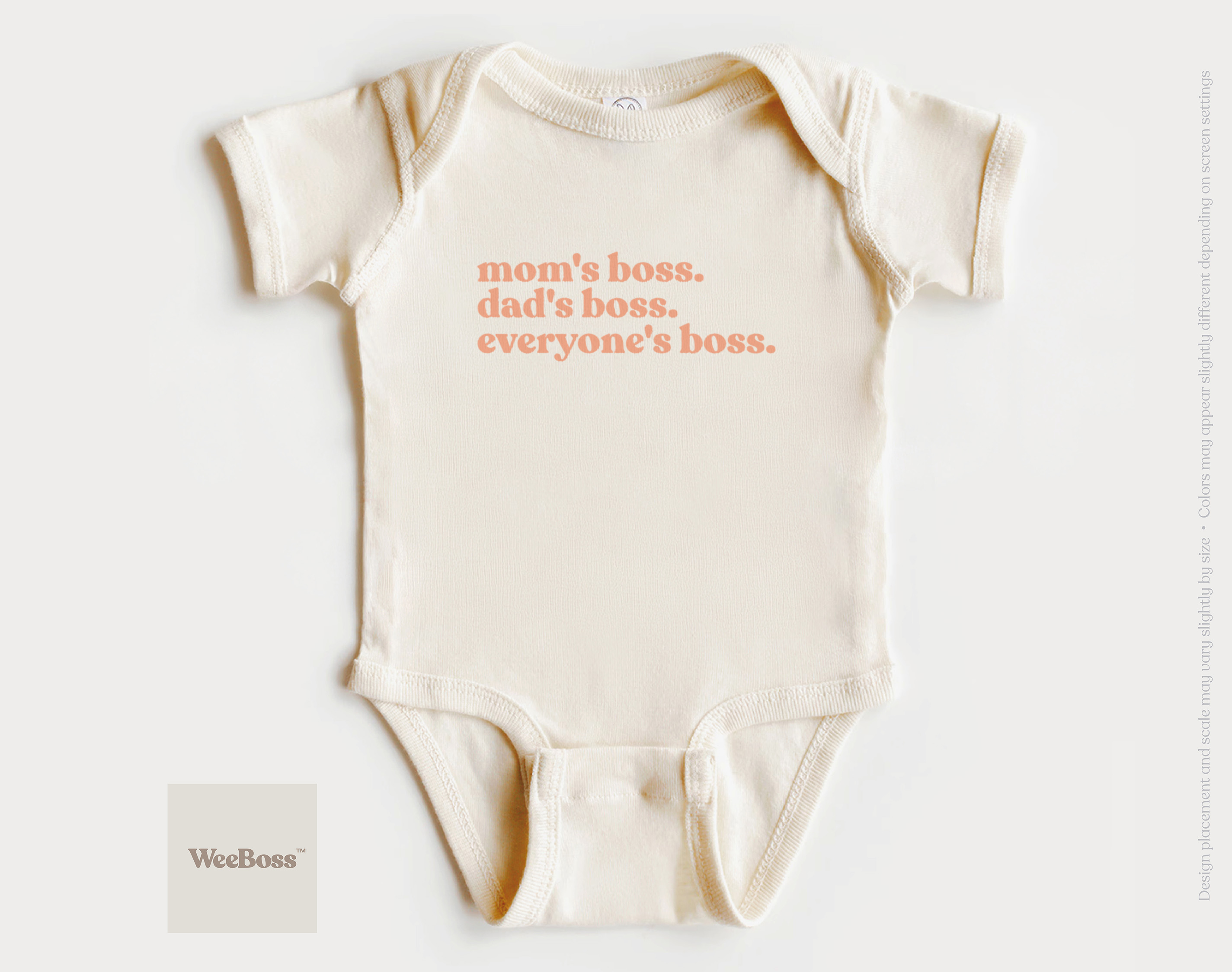 Mom's Boss. Dad's Boss. Everyone's Boss. baby bodysuit by WeeBoss — peach serif text on natural cream cotton