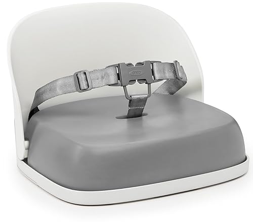 OXO Tot Perch portable booster seat clipped to dining chair